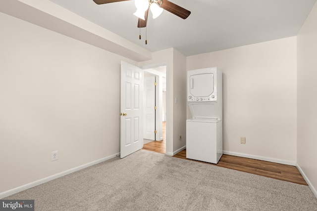 15 Warren Lodge Ct Unit 1D, Cockeysville, MD 21030 - unfurnished bedroom with stacked washing machine and dryer, carpet floors, and a ceiling fan