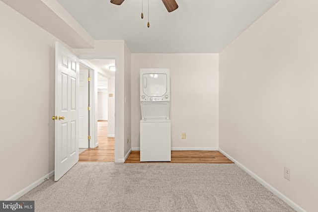 15 Warren Lodge Ct Unit 1D, Cockeysville, MD 21030 - unfurnished bedroom with stacked washing machine and dryer, carpet floors, and ceiling fan