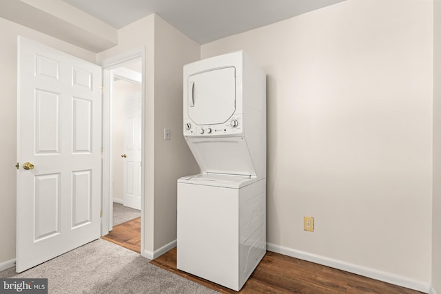 15 Warren Lodge Ct Unit 1D, Cockeysville, MD 21030 - washroom with stacked washer / dryer and dark wood-style flooring