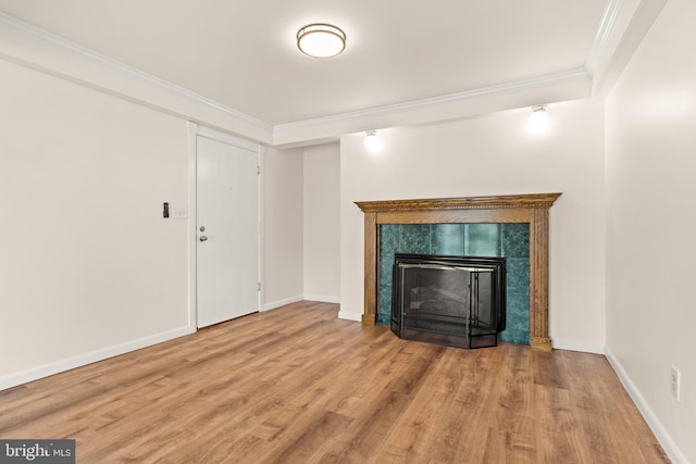 15 Warren Lodge Ct Unit 1D, Cockeysville, MD 21030 - unfurnished living room featuring ornamental molding, wood finished floors, and a fireplace