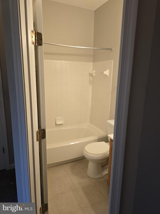 bathroom featuring tile patterned floors, toilet, and shower / bathtub combination