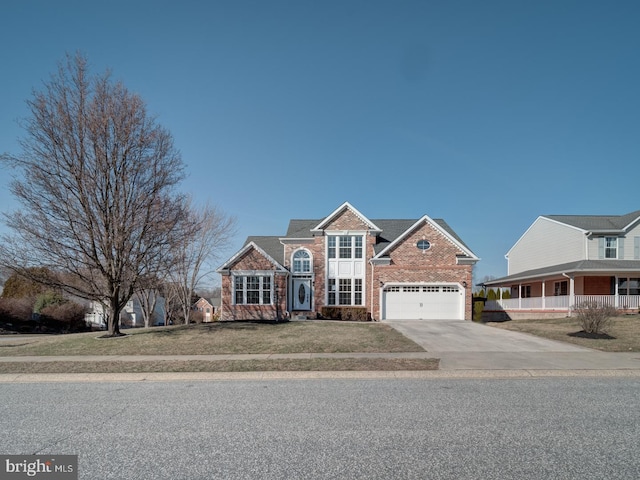 traditional home featuring brick siding, concrete driveway, a front lawn, and an attached garage