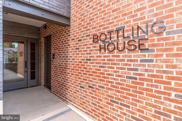 521 N Washington St Unit 201, Alexandria, VA 22314 - view of exterior entry with brick siding