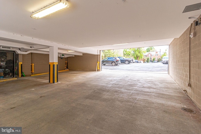 521 N Washington St Unit 201, Alexandria, VA 22314 - parking garage featuring concrete block wall