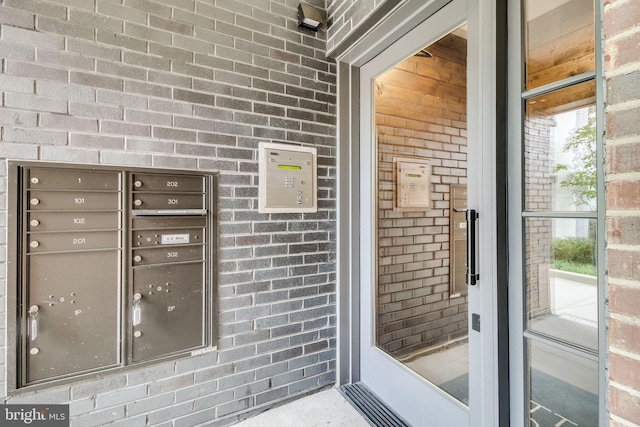 521 N Washington St Unit 201, Alexandria, VA 22314 - doorway to property featuring brick siding