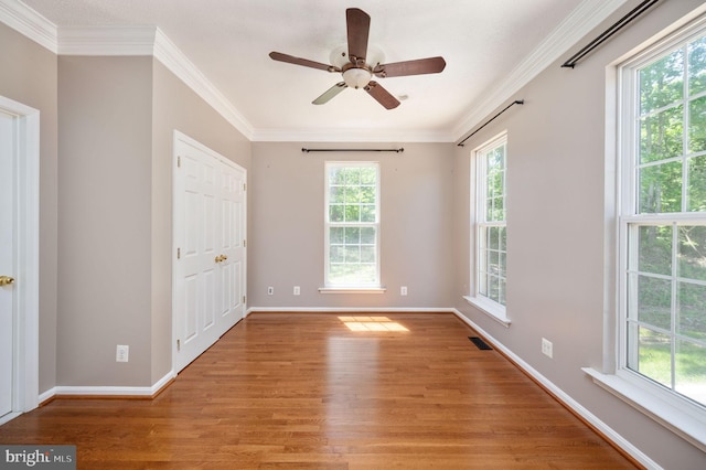 9129 Pebble Beach Ln, King George, VA 22485 - unfurnished room with light wood-type flooring, ornamental molding, baseboards, and ceiling fan
