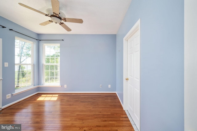 9129 Pebble Beach Ln, King George, VA 22485 - empty room featuring wood finished floors, baseboards, and ceiling fan
