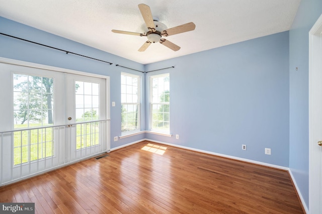 9129 Pebble Beach Ln, King George, VA 22485 - unfurnished room with hardwood / wood-style floors, baseboards, and ceiling fan
