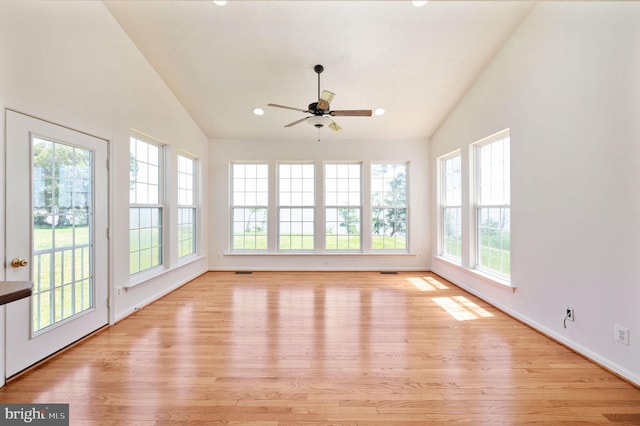 9129 Pebble Beach Ln, King George, VA 22485 - unfurnished sunroom featuring plenty of natural light, vaulted ceiling, wood finished floors, recessed lighting, and baseboards