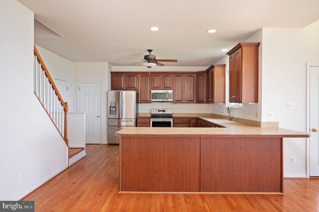 9129 Pebble Beach Ln, King George, VA 22485 - kitchen featuring stainless steel appliances, a sink, ceiling fan, light countertops, and recessed lighting