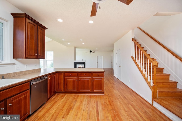 9129 Pebble Beach Ln, King George, VA 22485 - kitchen featuring dishwasher, ceiling fan, a peninsula, light wood-type flooring, and recessed lighting