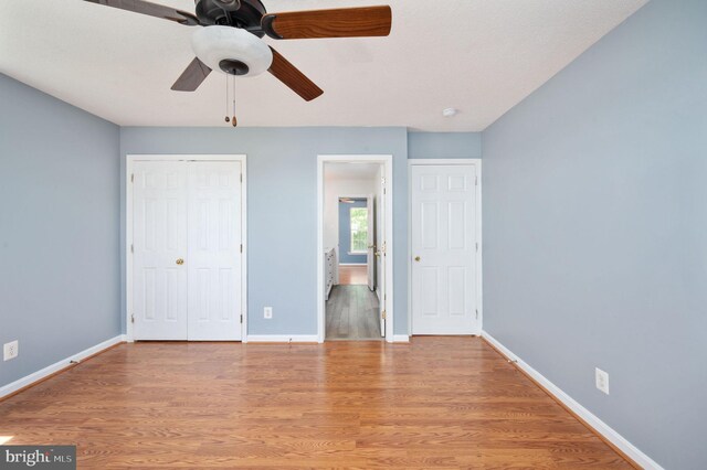 9129 Pebble Beach Ln, King George, VA 22485 - unfurnished bedroom featuring light wood finished floors, baseboards, a closet, and ensuite bath