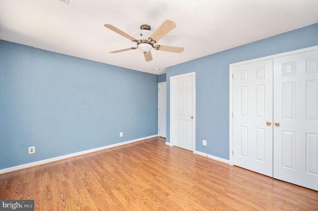 9129 Pebble Beach Ln, King George, VA 22485 - unfurnished bedroom with wood finished floors, baseboards, and ceiling fan