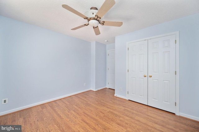 9129 Pebble Beach Ln, King George, VA 22485 - unfurnished bedroom featuring light wood finished floors, baseboards, a closet, and ceiling fan