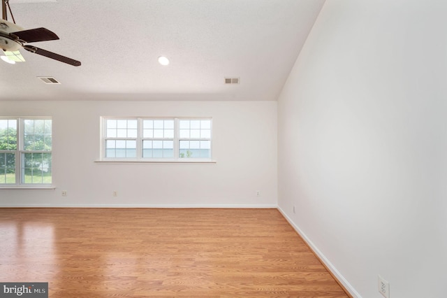 9129 Pebble Beach Ln, King George, VA 22485 - unfurnished room with light wood-style flooring, a ceiling fan, baseboards, and a textured ceiling