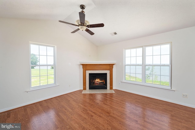 9129 Pebble Beach Ln, King George, VA 22485 - unfurnished living room with a fireplace with flush hearth, wood finished floors, ceiling fan, vaulted ceiling, and baseboards