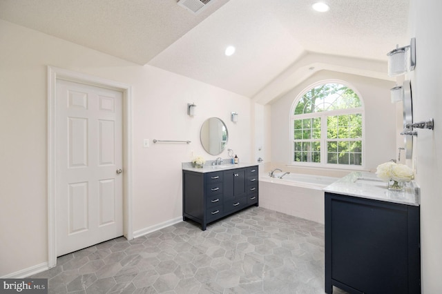 9129 Pebble Beach Ln, King George, VA 22485 - bathroom featuring vaulted ceiling, a bath, and vanity
