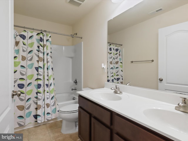 full bath with a sink, double vanity, toilet, and visible vents