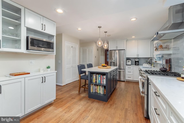 4401 Aragon Pl, Alexandria, VA 22309 - kitchen featuring appliances with stainless steel finishes, wall chimney exhaust hood, a sink, open shelves, and light countertops