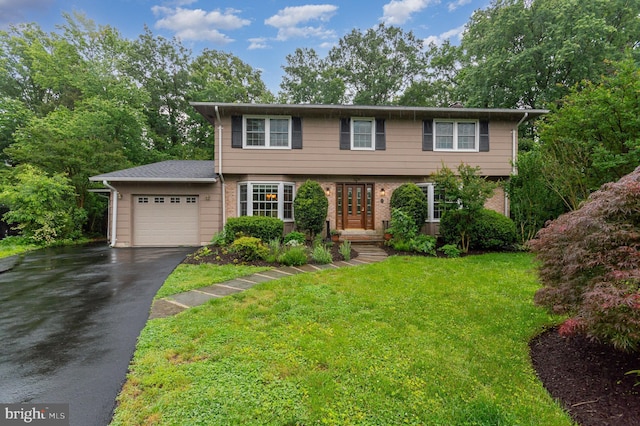 4401 Aragon Pl, Alexandria, VA 22309 - colonial-style house featuring a garage, asphalt driveway, brick siding, and a front yard
