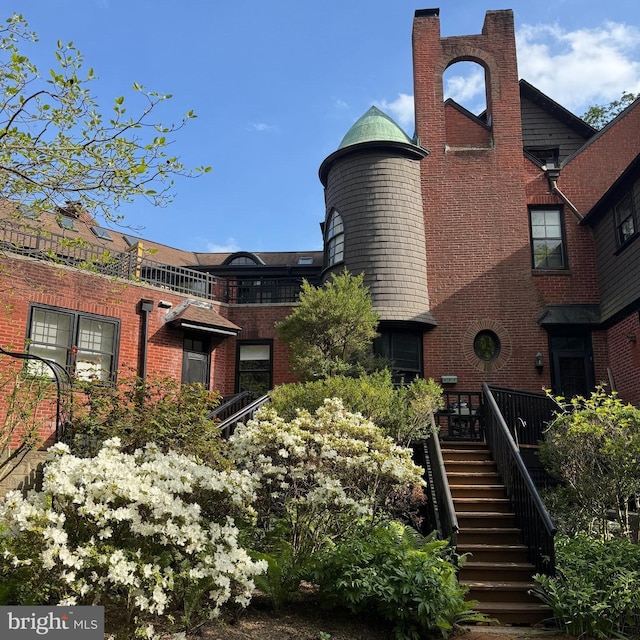 403 E Evergreen Ave Unit C, Philadelphia, PA 19118 - exterior space with stairway and brick siding