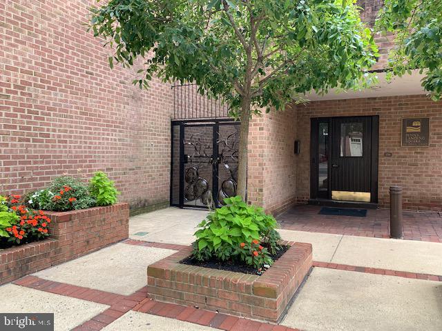 view of exterior entry with brick siding