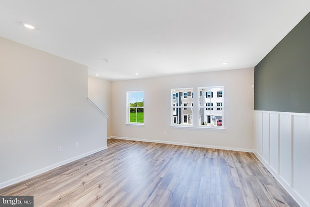 empty room featuring light wood-style floors and recessed lighting