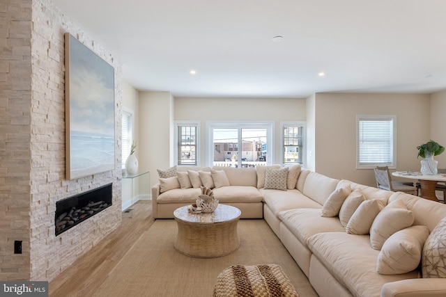 135 Walnut Ave, North Wildwood, NJ 08260 - living room with light wood-style floors, recessed lighting, and a stone fireplace
