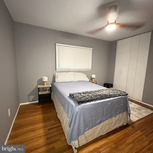 395 Hickory Ave, Carneys Point, NJ 08069 - bedroom with wood finished floors, baseboards, a closet, and a ceiling fan