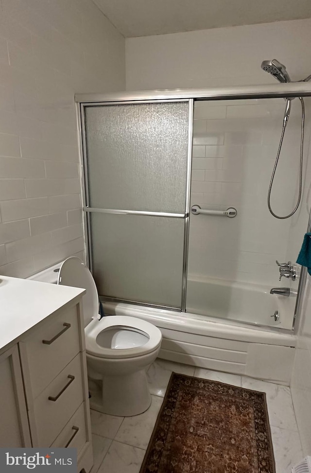 395 Hickory Ave, Carneys Point, NJ 08069 - bathroom featuring marble look tile flooring, vanity, enclosed tub / shower combo, and toilet