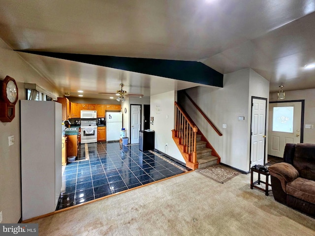 living area featuring stairway, lofted ceiling, dark colored carpet, and baseboards