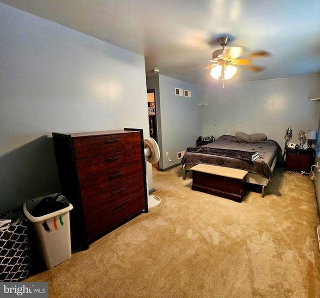 bedroom featuring light colored carpet and ceiling fan