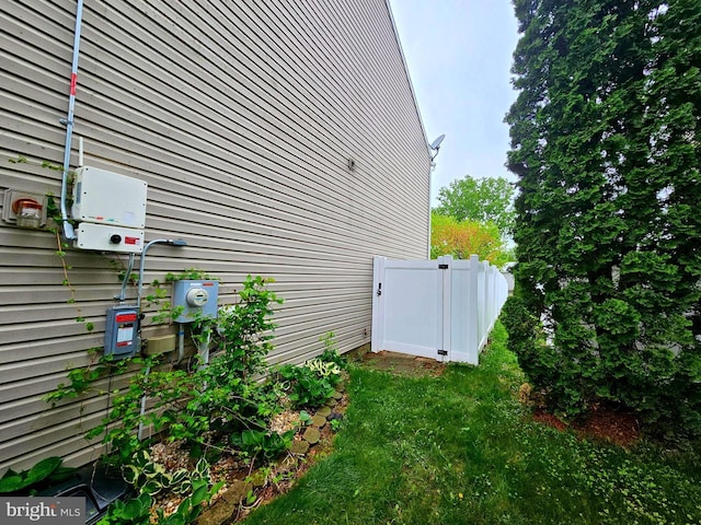 view of side of home with fence