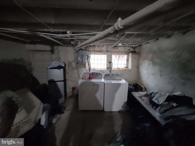 below grade area featuring separate washer and dryer and electric panel