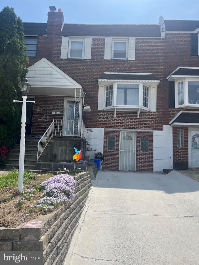 townhome / multi-family property with brick siding