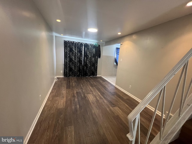 interior space featuring baseboards, recessed lighting, wood finished floors, and stairway