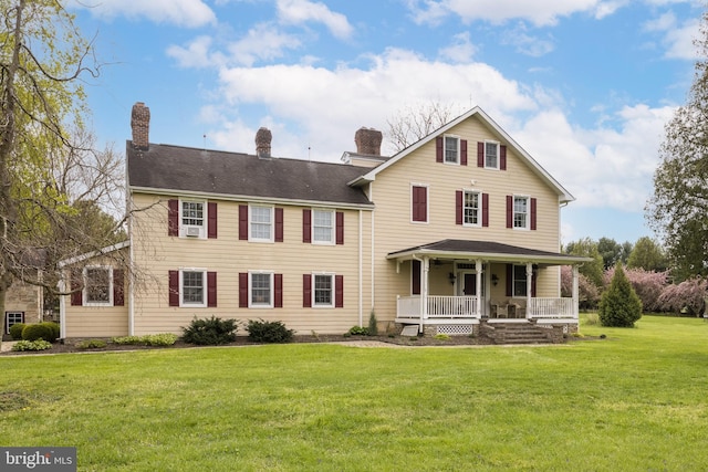 3401 Old Level Rd, Havre De Grace, MD 21078 - rear view of house with covered porch, a chimney, and a lawn