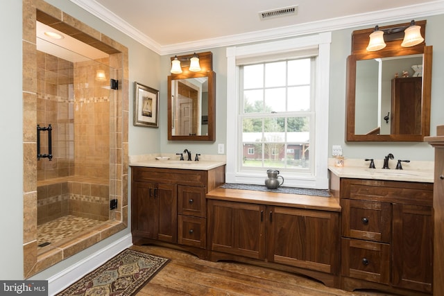 3401 Old Level Rd, Havre De Grace, MD 21078 - full bath featuring a stall shower, wood finished floors, two vanities, and crown molding
