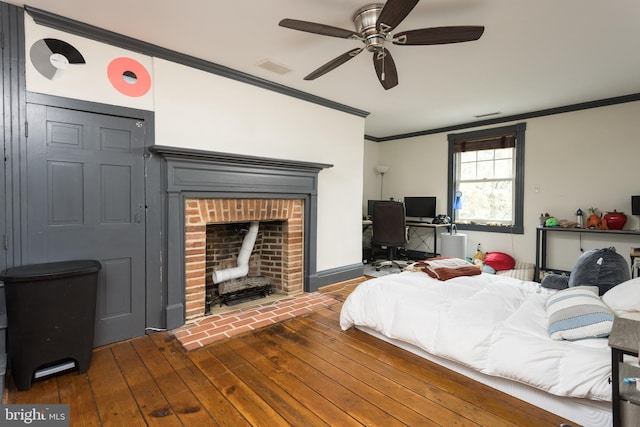 3401 Old Level Rd, Havre De Grace, MD 21078 - bedroom with hardwood / wood-style flooring, crown molding, a brick fireplace, a ceiling fan, and a desk