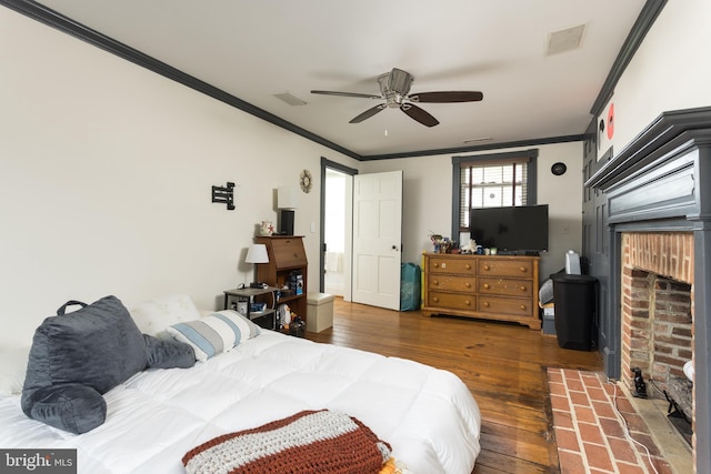 3401 Old Level Rd, Havre De Grace, MD 21078 - bedroom with crown molding, hardwood / wood-style floors, a brick fireplace, and ceiling fan