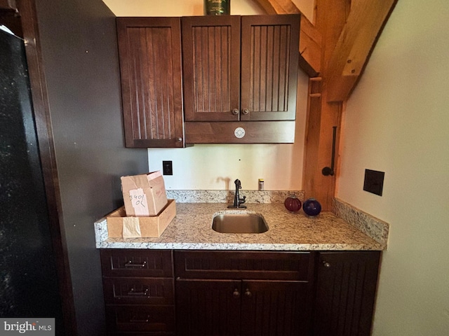 3401 Old Level Rd, Havre De Grace, MD 21078 - kitchen featuring a sink, dark brown cabinetry, and light stone countertops