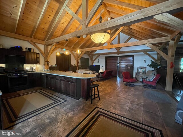 3401 Old Level Rd, Havre De Grace, MD 21078 - kitchen featuring black range with gas cooktop, open floor plan, a breakfast bar, a peninsula, and wood ceiling