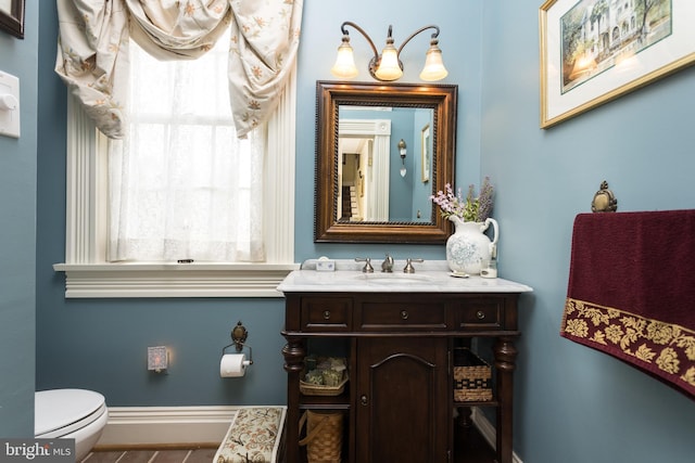 3401 Old Level Rd, Havre De Grace, MD 21078 - half bathroom featuring vanity, baseboards, and toilet