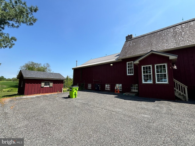 3401 Old Level Rd, Havre De Grace, MD 21078 - view of side of home featuring entry steps, a chimney, and an outdoor structure