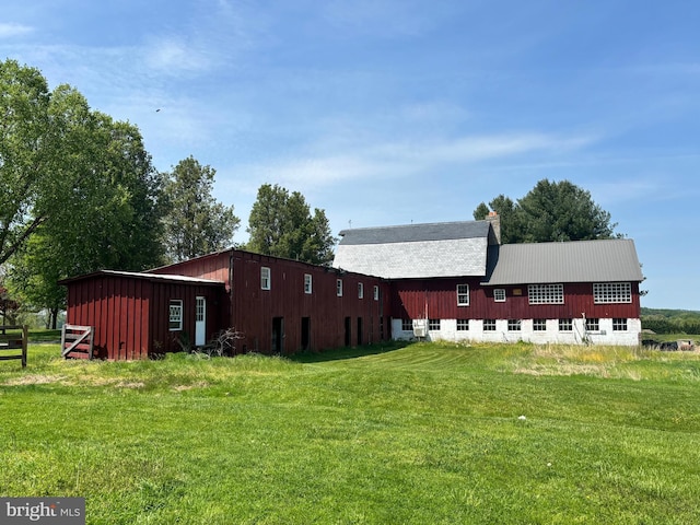 3401 Old Level Rd, Havre De Grace, MD 21078 - back of house featuring a yard, an outbuilding, and board and batten siding