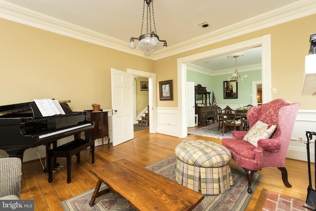 3401 Old Level Rd, Havre De Grace, MD 21078 - living room with a chandelier, hardwood / wood-style flooring, stairway, wainscoting, and ornamental molding