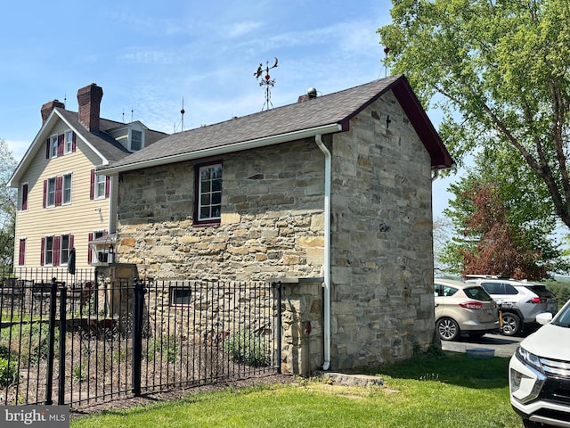 3401 Old Level Rd, Havre De Grace, MD 21078 - view of side of home featuring stone siding, a chimney, and roof with shingles
