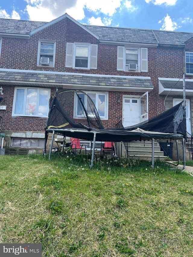 2818 Hellerman St, Philadelphia, PA 19149 - back of house featuring a high end roof, cooling unit, a yard, and brick siding