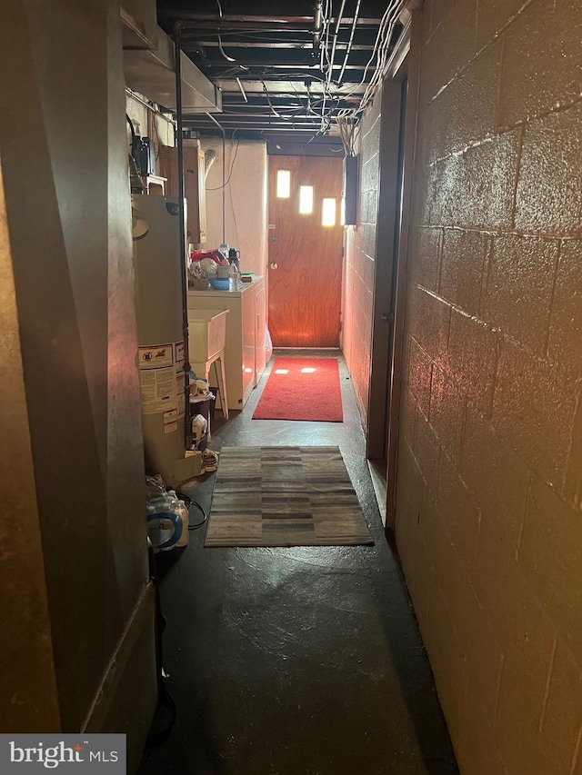 2818 Hellerman St, Philadelphia, PA 19149 - hallway with washer and clothes dryer, gas water heater, electric panel, and concrete block wall