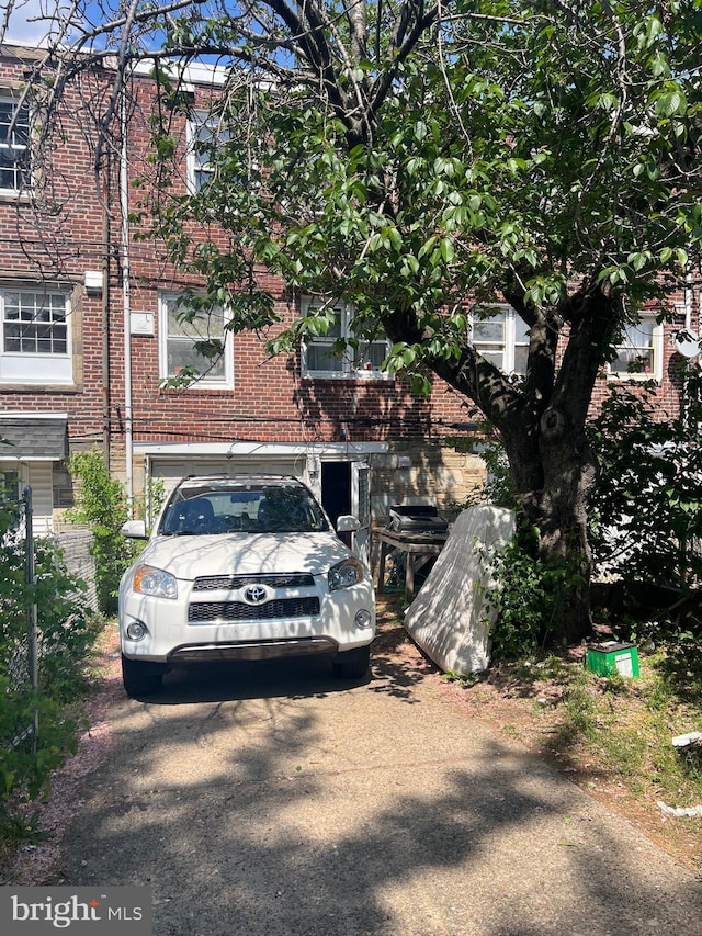 2818 Hellerman St, Philadelphia, PA 19149 - view of front facade featuring brick siding and driveway